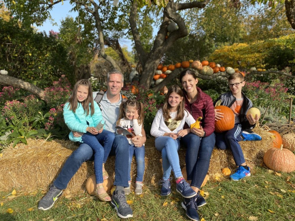 Family of 6 in front of pumpkin Display at the Holden Arboretum in Kirtland, Ohio
