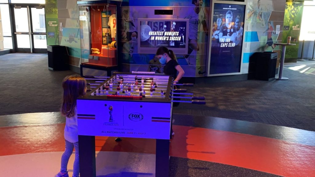 2 girls play at the Fooseball table at the National Soccer Hall of Fame in Frisco Texas