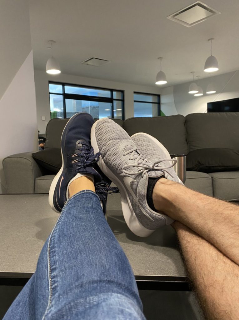husband and wife relax with feet up in the Parent Room at KidZania