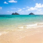 Blue water and small islands off the coast of Lanikai Beach on Oahu Hawaii