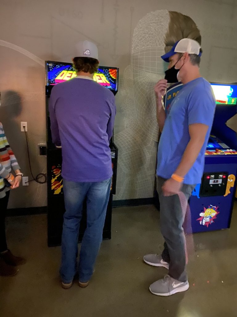 2 dads play old school arcades at the National Video Game Museum