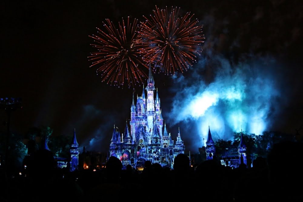 Fireworks explode over the Disneyworld Castle on an anniversary trip to Disney.  