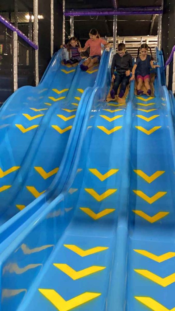 4 kids race down slides at 4Kidz Fun Park