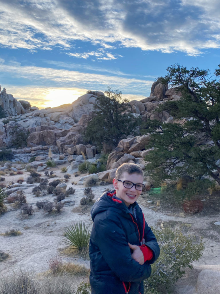 Sunsetting in Hidden Valley hike with boy in Joshua Tree