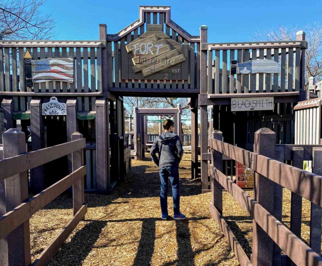 A boy enters Fort Imagination Park in Abilene