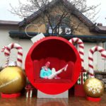 A girl Relaxes in an ornament decoration at Christmas in Frankenmuth