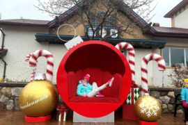 A girl Relaxes in an ornament decoration at Christmas in Frankenmuth