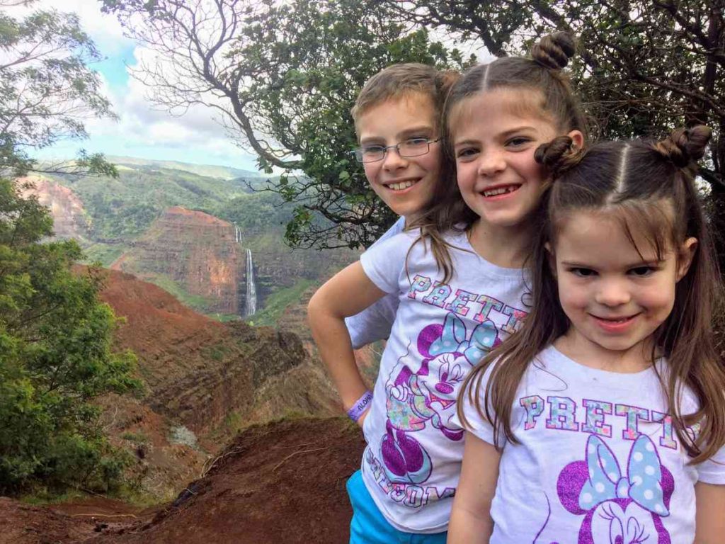 Three kids at Waimea Canyon Pu'u Ka Pele Lookout to Waipo'o Falls